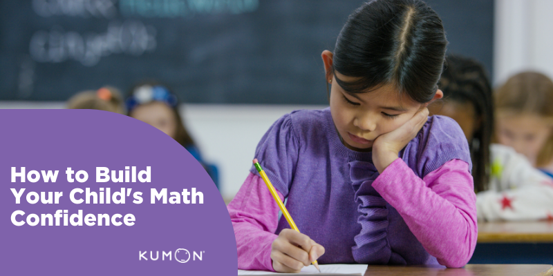 young girl doing math in a classroom