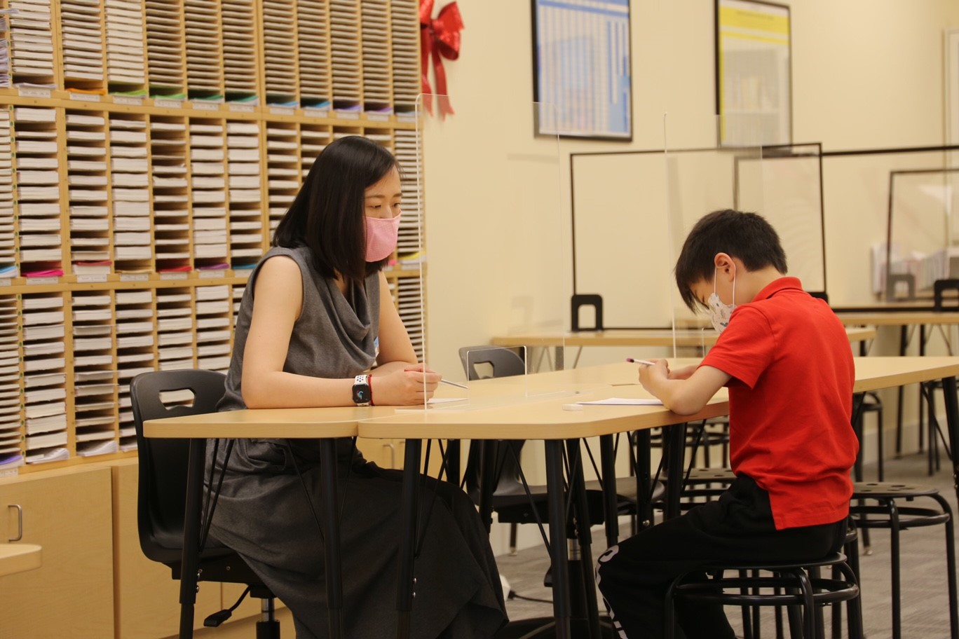 Sasha working with student