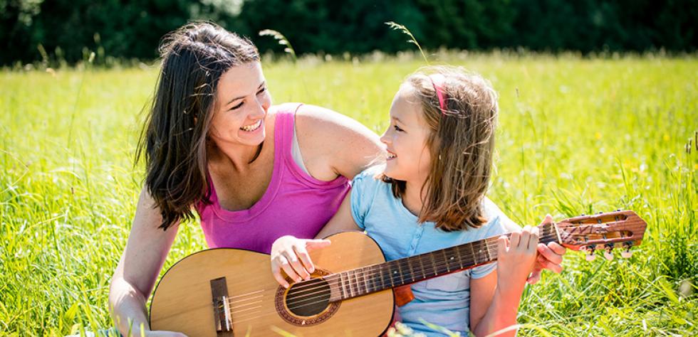 Mom and girl with guitar