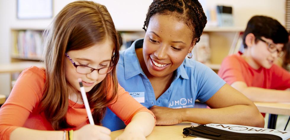 Kumon instructor with student