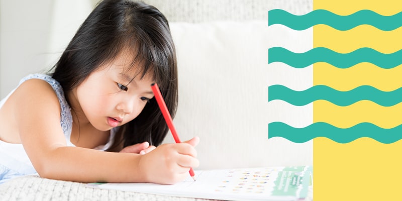 pre-school student studying to prepare herself