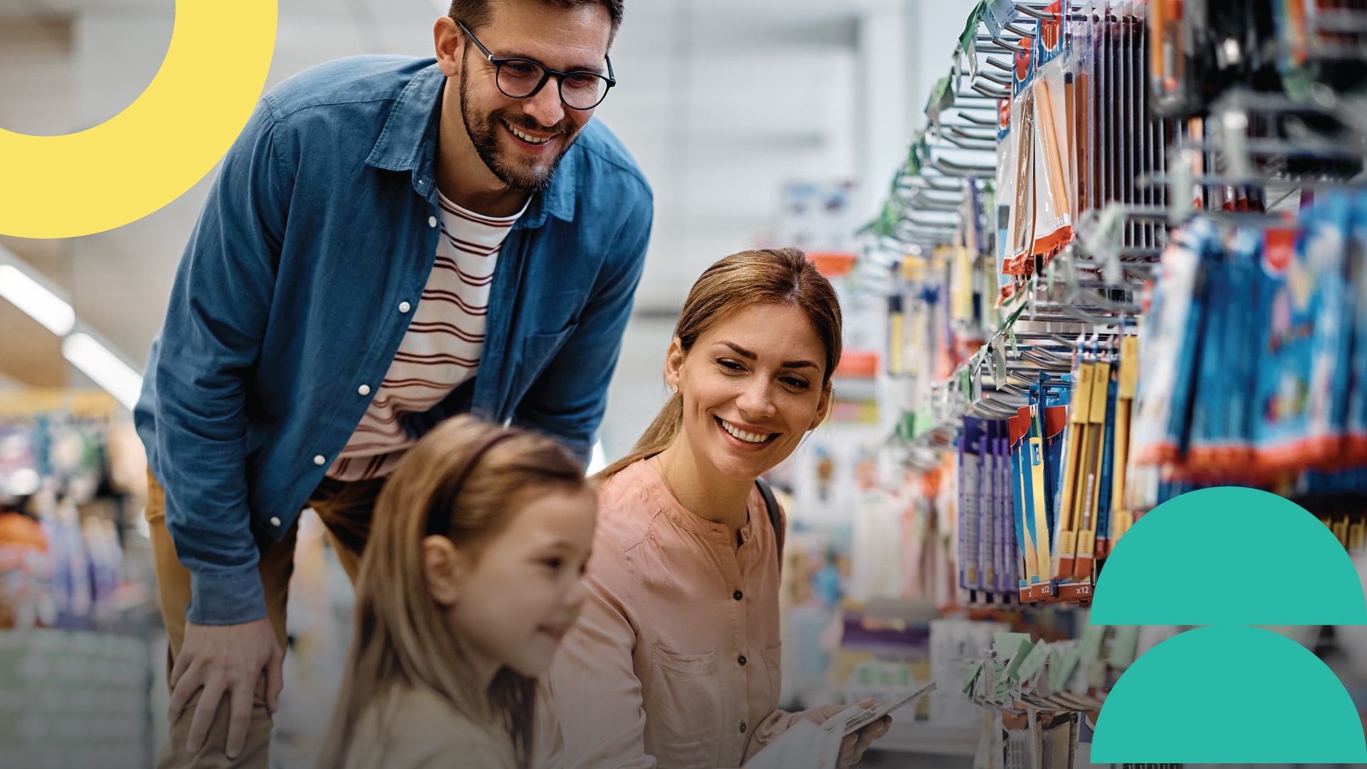 Parents in a store with their daughter shopping for school supplies to prepare them for the new school year